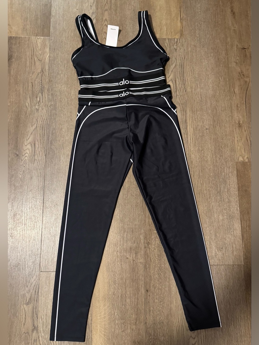 ALO Yoga Black Jumpsuit with White Piping Accents